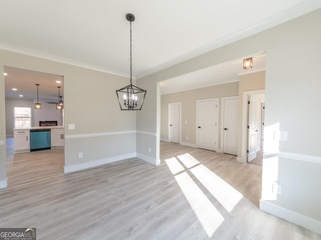 4392 Navajo Ln SE, Acworth, GA 30102 - unfurnished dining area featuring baseboards, an inviting chandelier, and light wood-style flooring