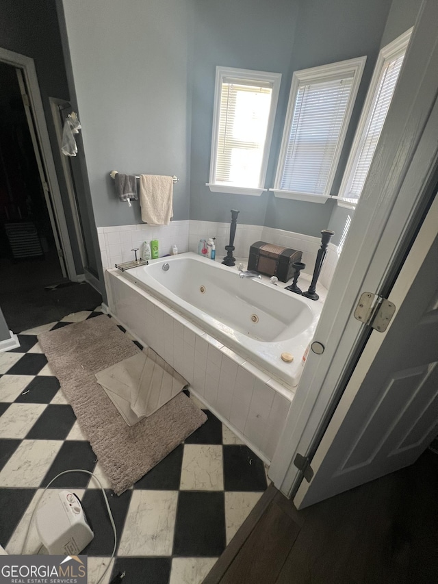 bathroom with tiled bath