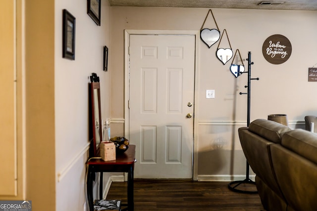 foyer featuring dark hardwood / wood-style floors