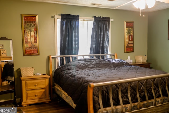 bedroom with ceiling fan and hardwood / wood-style flooring