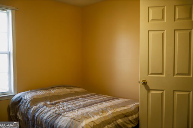 bedroom with multiple windows