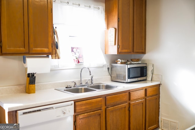 kitchen with sink and white dishwasher