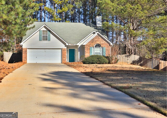 ranch-style house featuring a garage