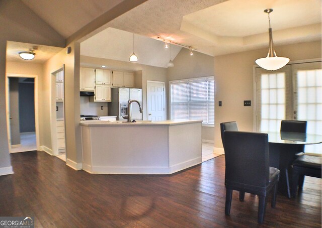 hall with dark wood-type flooring and a textured ceiling