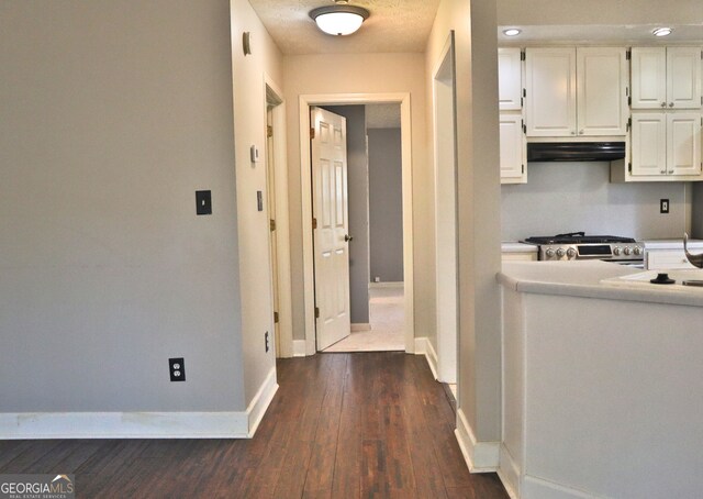 kitchen with pendant lighting, sink, ceiling fan, dark hardwood / wood-style flooring, and vaulted ceiling