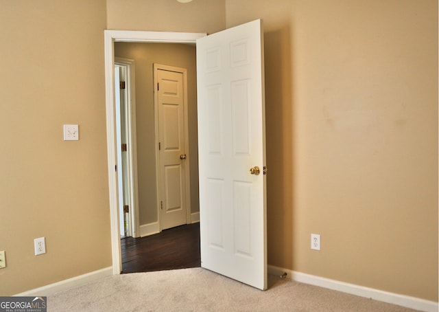 unfurnished bedroom featuring carpet