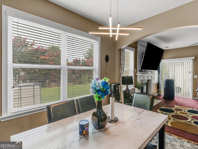 dining area featuring an inviting chandelier