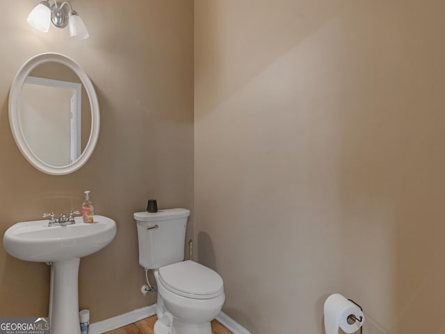 bathroom with sink and toilet