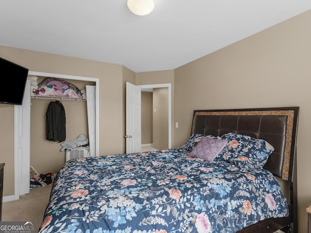 bedroom featuring carpet and a closet