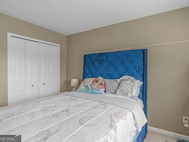 carpeted bedroom featuring a closet