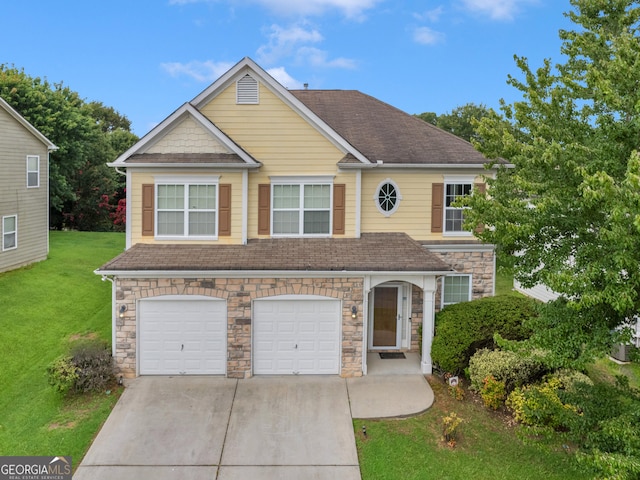 view of front of house featuring a front lawn and a garage