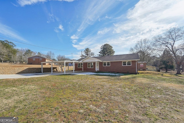 ranch-style house with a front yard and a carport