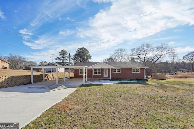 single story home featuring a front lawn and a carport