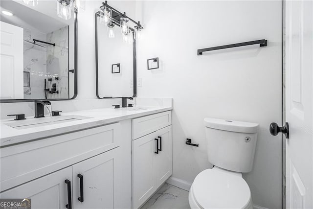 bathroom with vanity, a shower, and toilet