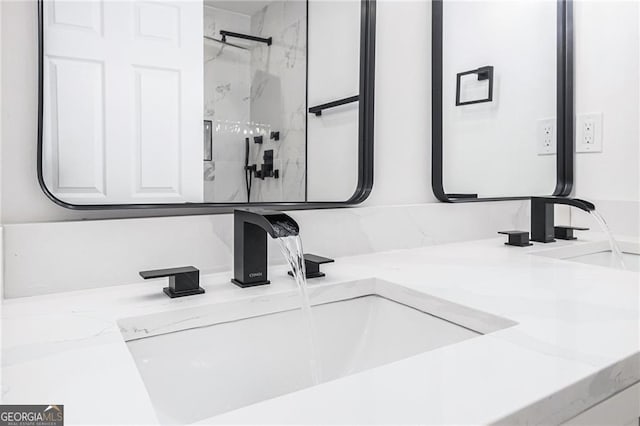 bathroom with vanity and walk in shower