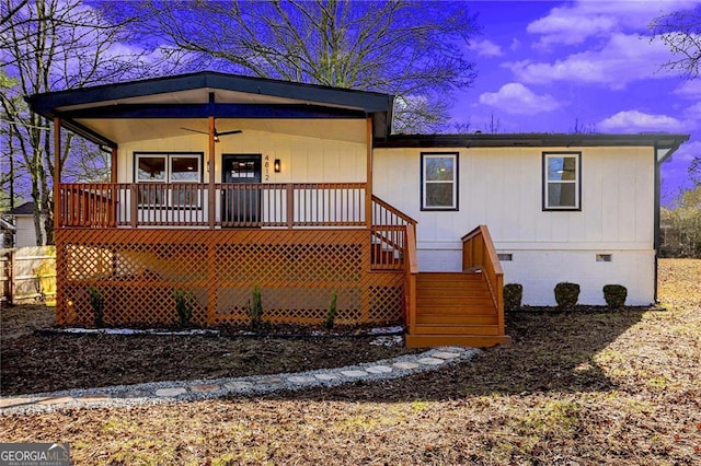 view of front of home featuring ceiling fan and a porch