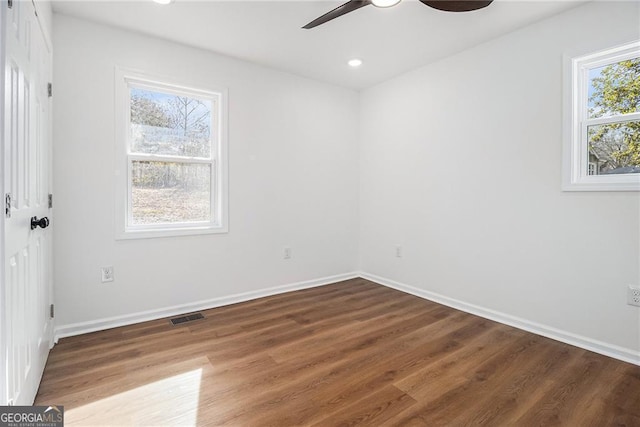 unfurnished room with wood-type flooring and ceiling fan