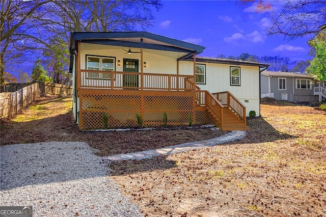 view of front of house featuring ceiling fan and covered porch