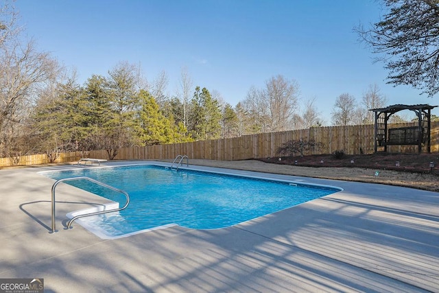 view of pool featuring a diving board, a patio area, a fenced backyard, and a fenced in pool