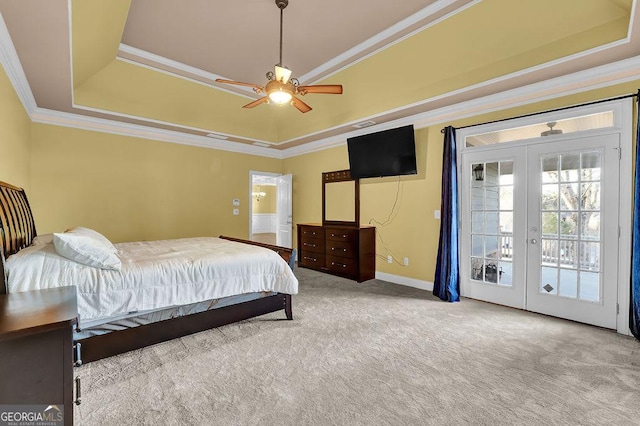 carpeted bedroom with ceiling fan, ornamental molding, a raised ceiling, and access to outside