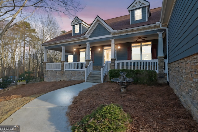 view of front facade with ceiling fan and covered porch