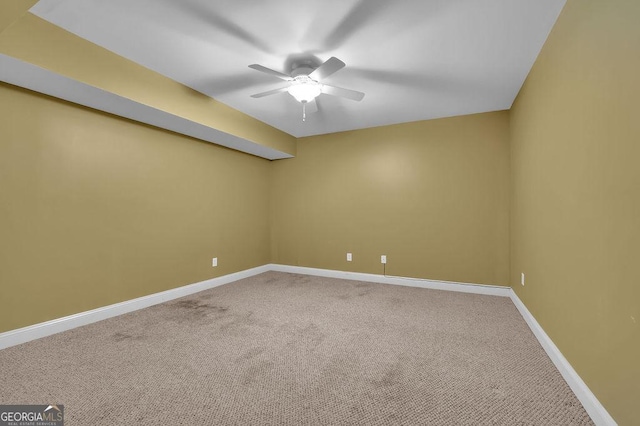 unfurnished room with carpet floors, ceiling fan, and baseboards