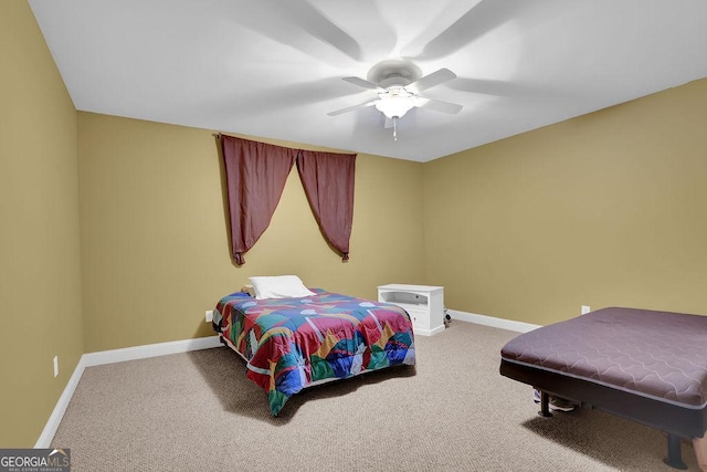 bedroom featuring a ceiling fan, carpet, and baseboards