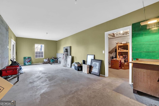 interior space featuring unfinished concrete floors