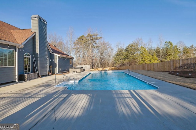 view of pool featuring a patio area, a fenced backyard, and a fenced in pool