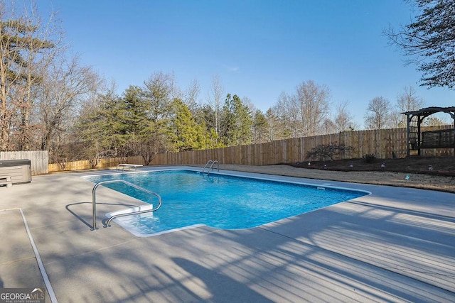 view of pool with a diving board, a patio, a fenced backyard, and a fenced in pool