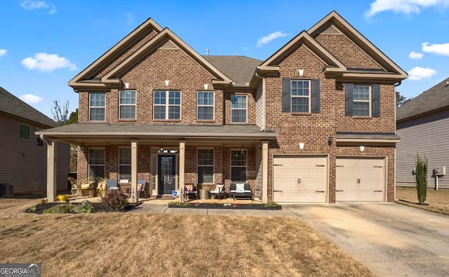 craftsman-style home with a garage, cooling unit, a front lawn, and a porch