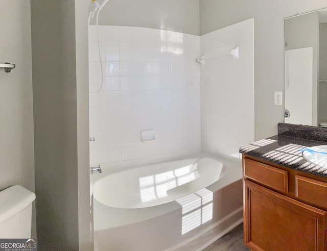 full bathroom with toilet, vanity, and shower / tub combination