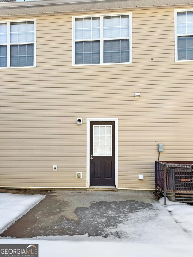 property entrance with central AC unit