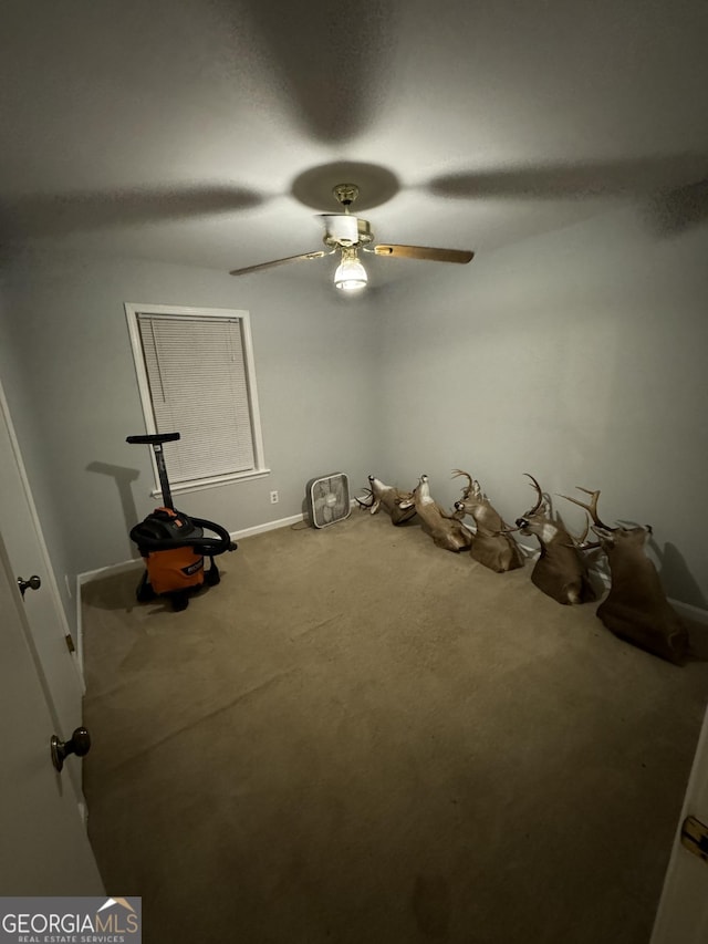 miscellaneous room with carpet floors and ceiling fan