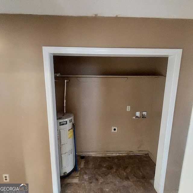 laundry room featuring hookup for a washing machine, water heater, and hookup for an electric dryer