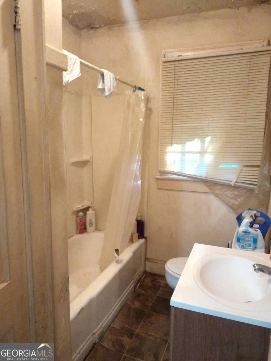 524 Ormond Ter, Macon, GA 31206 - bathroom featuring shower / bath combo with shower curtain, vanity, and tile patterned floors