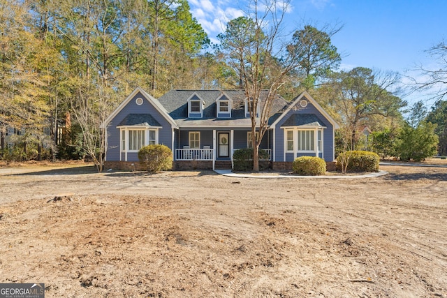 new england style home with a porch