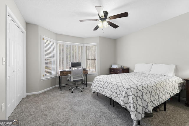 carpeted bedroom featuring a closet and ceiling fan