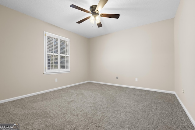 empty room with carpet and ceiling fan