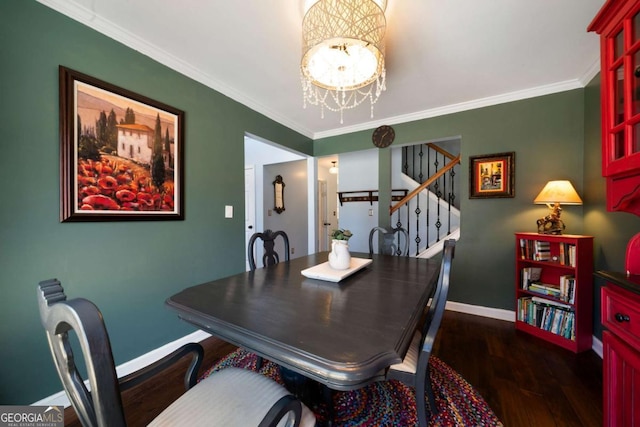 dining area featuring an inviting chandelier, crown molding, and dark hardwood / wood-style floors