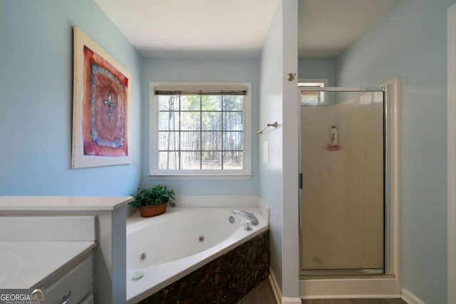 bathroom featuring separate shower and tub and vanity