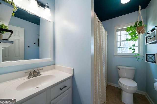 bathroom with toilet, tile patterned flooring, a shower with curtain, and vanity