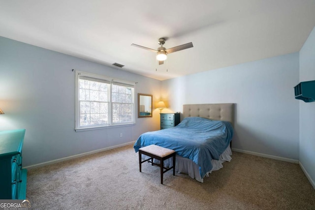 bedroom with ceiling fan and light colored carpet