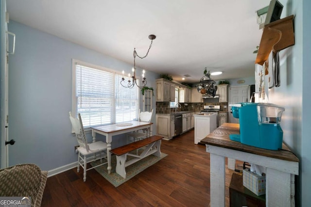 kitchen with dishwasher, decorative light fixtures, dark wood-type flooring, backsplash, and a notable chandelier