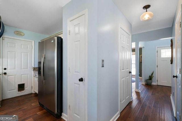 hallway with dark hardwood / wood-style flooring