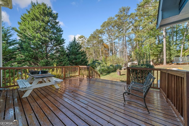 wooden deck with a trampoline