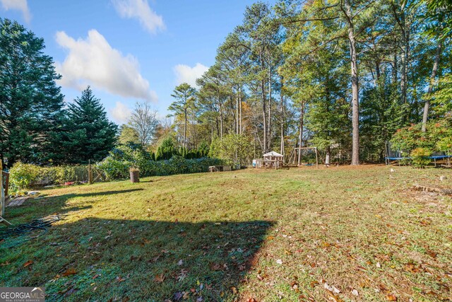 view of yard featuring a trampoline