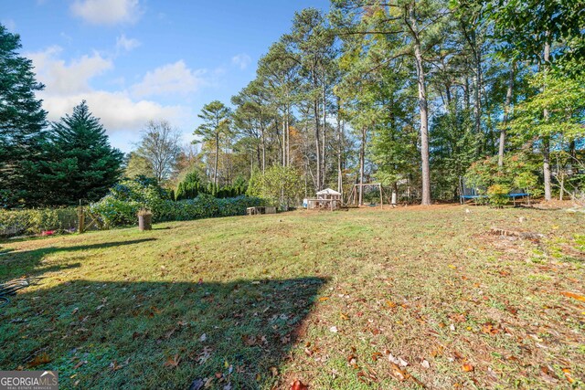 view of yard with a trampoline