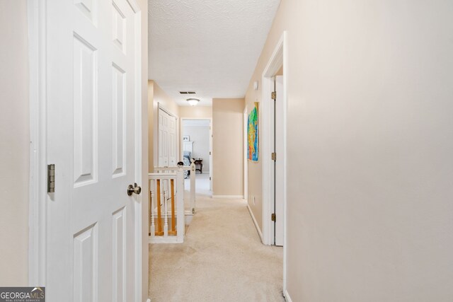 bedroom featuring lofted ceiling, a textured ceiling, ceiling fan, and carpet flooring