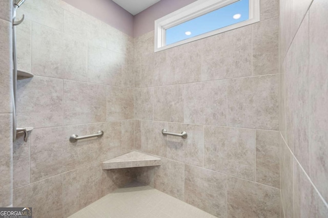 bathroom featuring tiled shower